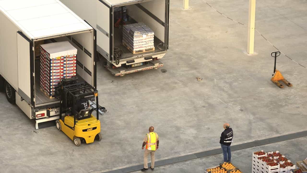 overhead view of an Edmonton industrial real estate property where a forklift is unloading a pallet from a semi truck